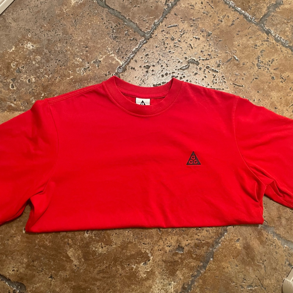 NIKE ACG shirt, runs a little big i’m normally a small but it fits me fine